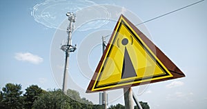 EMF Warning Sign and a 5G tower causing radiation under a blue sky