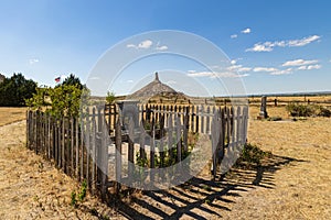 Emigrant graveyard in front of Chimney Rock, a prominent rock formation along the Oregon Trail, Bayard, Nebraska, USA photo