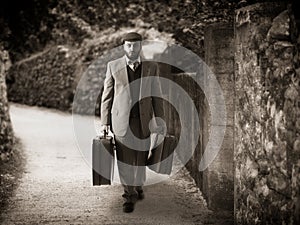 Emigrant with the suitcases