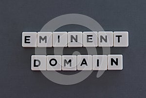 Eminent domain word made of square letter word on grey background photo