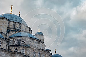 Eminonu New Mosque with cloudy sky on the background