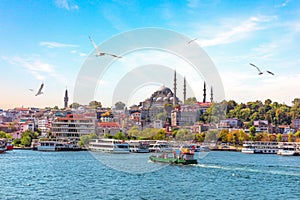 Eminonu Pier and Suleymaniye Mosque in Istanbul, Turkey photo