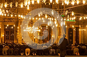 EminÃÂ¶nÃÂ¼, Istanbul / Turkey - 02 07 2014: Muslim men praying in Yeni Cami New Mosque interior