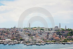 EminÃ¶nÃ¼ skyline in Istanbul, view of architecture and ships on a golden horn and mosque Suleymaniye