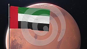 Emirates flag waving on the background of the planet Mars. United Arab Emirates