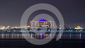 Emirates Palace illuminated at night timelapse, Abu Dhabi, United Arab Emirates