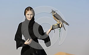 Emirati woman with a falcon