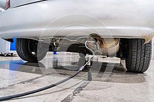 Emission control in the exhaust of an old car at a vehicle inspection station