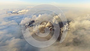 Emission to atmosphere from industrial pipes. Smokestack pipes shot with drone