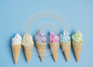 Emotion cartooning of colorful sweet ice cream cone isolated on blue pastel background ,holiday and relax concept