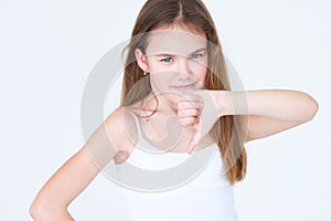 Emotion disapproving annoyed child thumb down girl photo