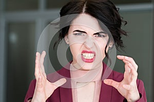 Emotion face rage fury strangle woman baring teeth photo