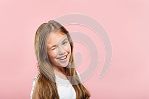 Emotion face smiling cute adolescent girl winking