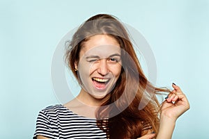 Emotion face smiling woman pleased winking