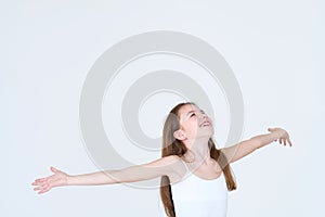 Emotion happy child looking up arms sideways rain