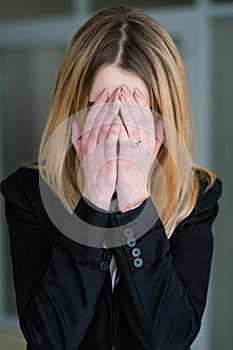 Emotion sad distraught woman covering hands crying