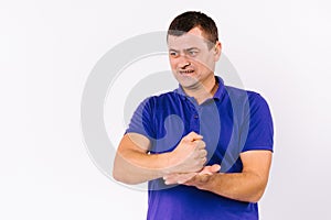 Emotional adult man with hearing impairment, looking side, shows sign gestures with his hands on a white background with