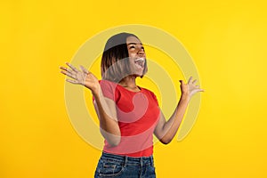 Emotional African American Lady Shouting In Excitement Over Yellow Background