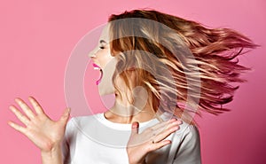 Emotional angry woman screaming shouting yelling closeup portrait on pink background