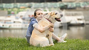 Emotional black and white portrait of a sad lonely girl hugging her dog