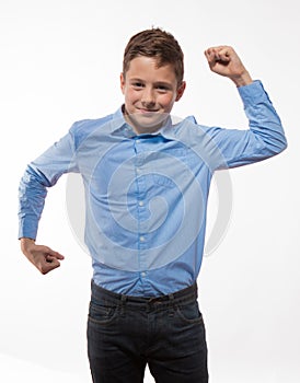 Emotional boy brunette in a blue shirt