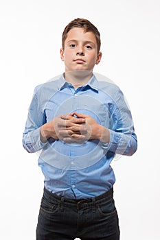 Emotional boy brunette in a blue shirt