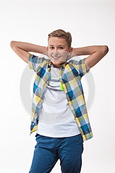 Emotional boy in a plaid shirt