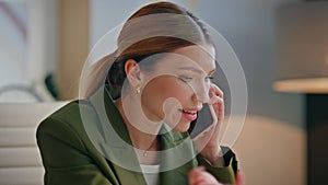 Emotional businesswoman answering call speaking mobile phone at cabinet closeup