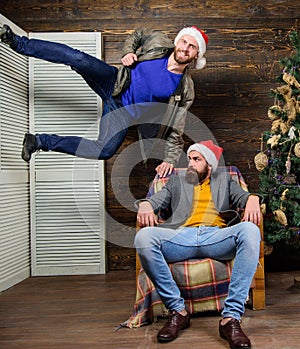 Emotional coup. Cant wait. Change point of view. Waiting for christmas. Cheerful men having fun near christmas tree