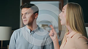 Emotional family conflict home closeup. Angry man arguing with nervous woman.