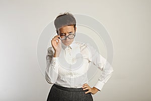 Emotional female teacher in glasses
