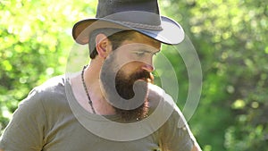 Emotional funny bearded hipster on the farm. Eco farm. Retro farmer man. handsome bearded farmer working with spud on