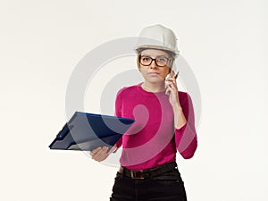 Emotional girl foreman in a helmet on a white background
