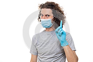 Emotional guy in medical mask and gloves. Pandemic coronavirus epidemic covid-19 quarantine isolated white