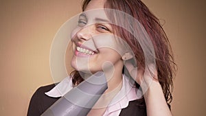 Emotional happy teenager girl make funny faces while drying her hair. Slow motion