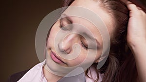 Emotional happy teenager girl make funny faces while drying her hair. Slow motion