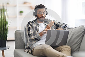 Emotional indian guy having video call with partner