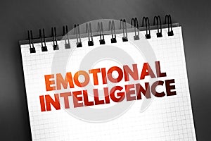 Emotional intelligence - ability to perceive, use, understand, manage, and handle emotions, text concept on notepad