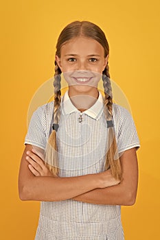 Emotional intelligence describes ability monitor your own emotions. Smiling girl. Adorable schoolgirl yellow background