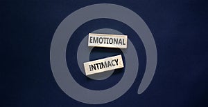 Emotional intimacy symbol. Concept words Emotional intimacy on beautiful wooden blocks. Beautiful black table black background. photo