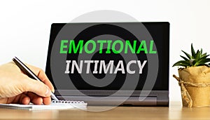 Emotional intimacy symbol. Concept words Emotional intimacy on beautiful black tablet. Beautiful white background. Psychologist