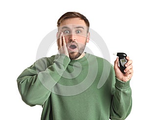 Emotional man with breathalyzer on white background