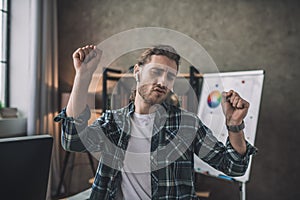 Emotional man dancing while listening to his favourite music