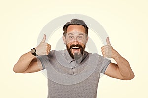 Emotional man with two thumbs up isolated on white background. Excited bearded guy happy face emotion. Thumbs up by both hands.