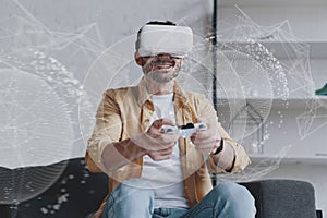 Emotional man in VR glasses playing game with joystick, innovation hologram