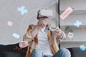 Emotional man in VR glasses playing video game with joystick, innovation hologram