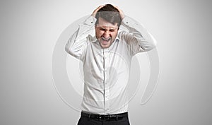 Emotional man in white shirt