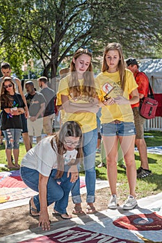 Emotional people View Section of AIDS Quilt