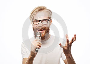 Emotional portrait of an attractive guy with a beard on white background