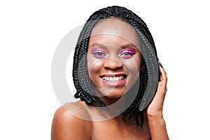 Emotional portrait of happy african american girl. pink make-up visage. white background. isolate